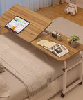Fully Height Adjustable Overbed Table With Silky Smooth Rolling Wheels And Totally Flexible Tilting Surface, Heavy Duty Steel Mobile Bed Desk Built Strong For Laptops Or Lazy Weekend Bites, Cozy Bedroom Essential on a bed with a tablet and books.