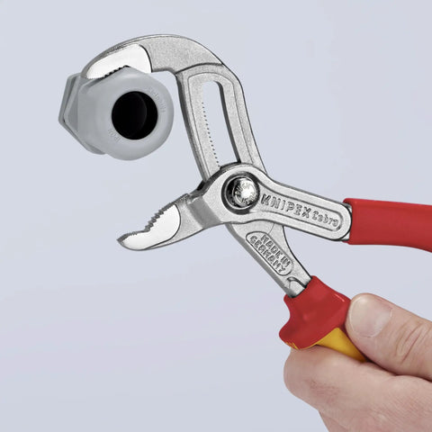 Cobra High Tech Water Pump Pliers 1000V Insulated With Tethered Attachment 10 Inch gripping a large nut