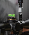 Pro Grade Dual Bubble Scope Leveling Kit For Foolproof Reticle Alignment One Handed Elevation Drop Adjustment Rifle Optics Zeroing Fixture mounted on a rifle scope.
