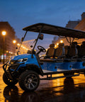 Blue Eight Seater Electric Golf Cart With Nonstop Range Tough Construction Comfy Cushions And Raw Power at dusk, parked on wet street.