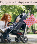 Coral Pink Polka Dot Wet Bag And Dry Bag For Beach And Pool Waterproof, Machine Washable And Reusable Swim Tote on a stroller