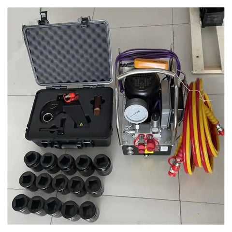 Heavy Duty Hydraulic Torque Wrench One Point Five Inch Square Drive 742 To 7420 Nm Range with accessories and sockets on display.