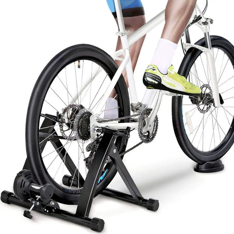 Cyclist using Magnetic Bike Trainer Stand For Indoor Cycling With Premium Steel Build Quiet Low Noise Operation Fits 26 To 28 Inch Wheels And 700C