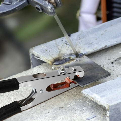Heavy Duty Welding Ground Clamp With Copper And Iron Build Designed For Secure Earth Connection Plus Strong Load Bearing Capabilities on metal work.