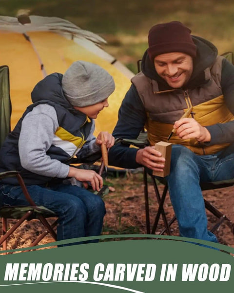 Father and son whittling wood blocks together outdoors, sitting near a yellow tent, focusing on wood carving activity.