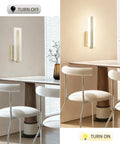 Tipace Hardwired Antique Bronze Modern LED Wall Sconce Indoor Wall Light on beige wall, illuminating elegant dining space.