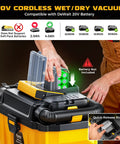 Person placing DeWalt 20V battery into cordless 2.5 gallon wet dry shop vacuum with 15KPa suction, brushless motor, and HEPA filter.