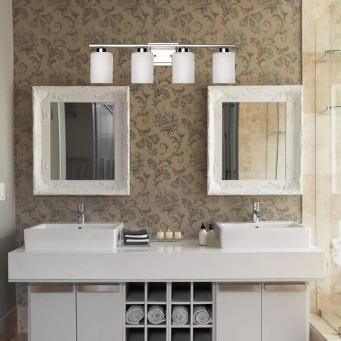 4 Light Brushed Nickel Bathroom Vanity Light Fixture With Frosted Glass Shades Over Mirror Wall Sconce For A Fresh Modern Bath Look
