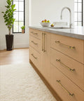 Modern kitchen with 10 Pack 3 Inch Antique Brass Cabinet Pulls, Vintage Zinc Alloy Handles on light wood drawers, aged brass hardware