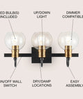 21.5 Inch Black And Brass Gold Vintage Wall Sconce With Clear Glass Globe Shade Sleek Industrial Arched LED Vanity Light For Bathroom Bedroom Entryway LED Bulb Included, close-up view.