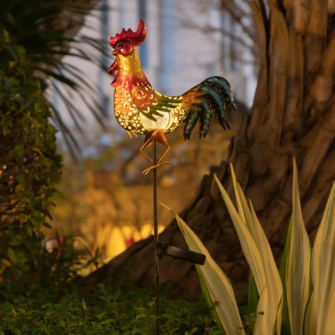 Rooster Solar Lights Outdoor Decor For Garden Yard Art Statue, glowing metal rooster by tree in nighttime garden setting