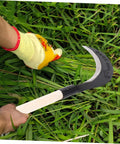Person using Manganese Steel Hand Scythe For Weeding And Cultivation With Comfortable Grip One Handed Garden Tool For Efficient Weeding