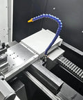 Heavy Duty Flexible Coolant Hose For Machine Shops Straight Up Rock Solid Water And Oil Delivery Tube With Swivel Threaded Ends positioned near cutting area on a lathe.