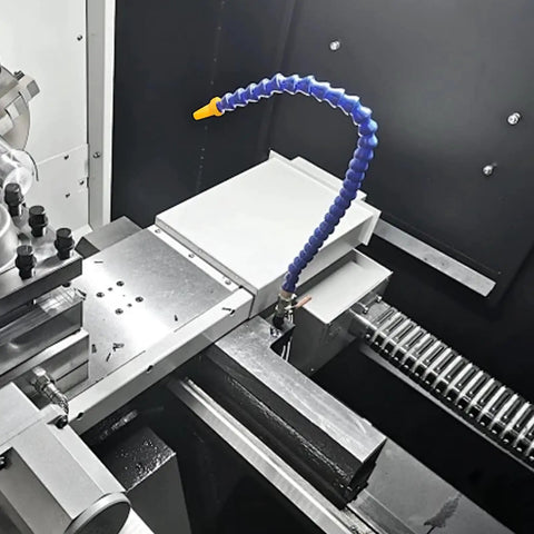Heavy Duty Flexible Coolant Hose For Machine Shops Straight Up Rock Solid Water And Oil Delivery Tube With Swivel Threaded Ends positioned near cutting area on a lathe.
