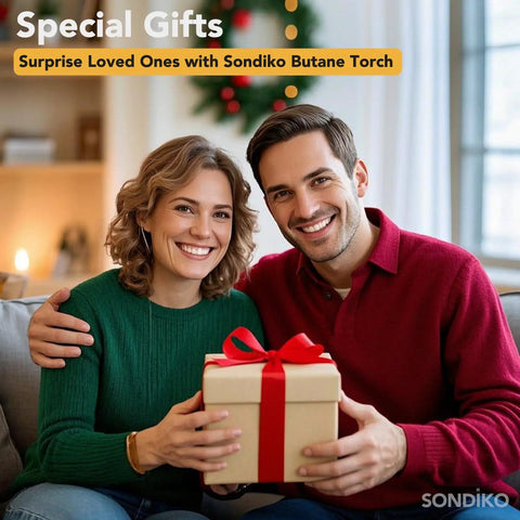 Couple sitting together holding a wrapped gift box in a holiday decorated room.