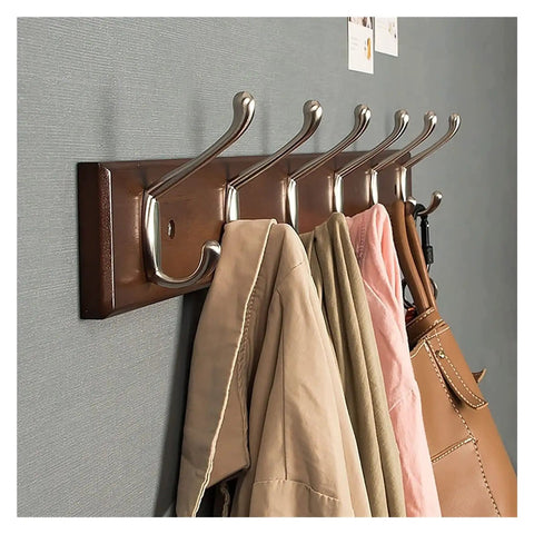 Beefy Wood And Zinc Alloy Wall Mounted Coat Rack With Rock Hard Hooks displaying multiple coats and bags organized on a solid wood frame.