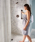 Woman using Oil Rubbed Bronze 24 Inch Stainless Steel Bathroom Grab Bar For Safety And Stability Traditional Style Easy Install