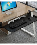 Rock Solid Retractable Keyboard Tray With Slick Pull Out Action For Effortless Typing And Plenty Of Mouse Space Totally Clutter Free Under Desk Office Essential Black mounted under a desk with keyboard and mouse.