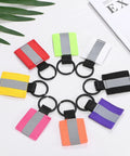 Assorted reflective safety keychain tags including Four Pack Fluorescent Green Reflective Safety Pendants for night activities.