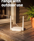 Top Tier Wireless Outdoor Security Kit With Four Super Clear Cameras Plus A 2K Battery Video Doorbell on wooden table
