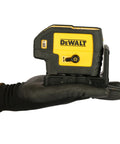 Professional Grade Self Leveling Laser Level Built Tough For The Jobsite held in hand, showing controls and size details.
