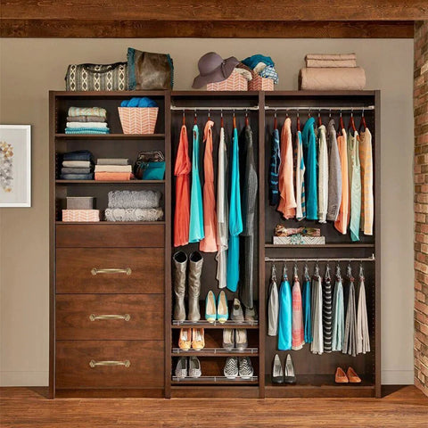 Walk-in closet with rustic barn door handles featuring vintage solid brass pulls in antique copper finish, cabinets and drawers.