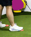 Golfer using Golf Force Pedal Training Aid And Force Plate for Swing Control And Balance Game Changer on turf