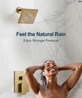 GRANDJOY 6" Wall Mount Shower System with Handheld Spray, Brushed Gold, featuring a square showerhead and user enjoying a refreshing shower.