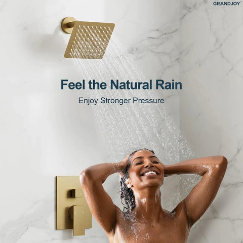 GRANDJOY 6" Wall Mount Shower System with Handheld Spray, Brushed Gold, featuring a square showerhead and user enjoying a refreshing shower.