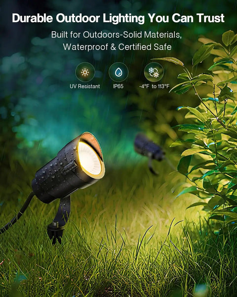 12W 2900K COB LED Low Voltage Landscape Spotlight illuminating a garden, showcasing its waterproof design and 36-degree beam focus.