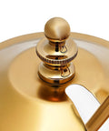 Close-up of golden Royal Belgian Siphon Coffee Maker In Gold Retro Siphon Brewer lid, showing elegant design detail.