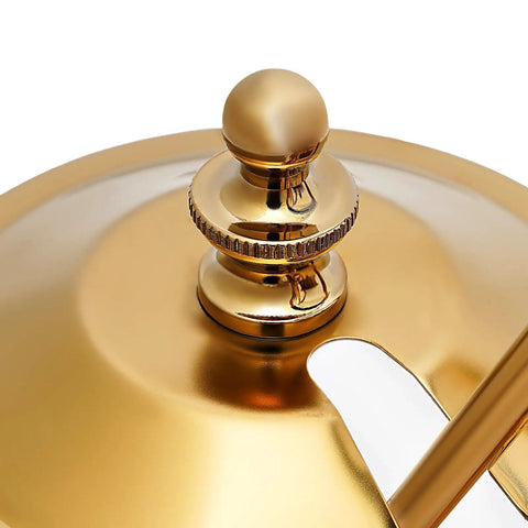 Close-up of golden Royal Belgian Siphon Coffee Maker In Gold Retro Siphon Brewer lid, showing elegant design detail.