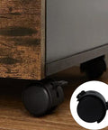 Four Pack 1.5 Inch Universal Caster Wheels With Brakes installed on wooden office furniture close-up view