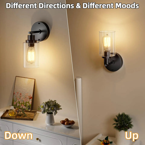 One Light Matte Black Bathroom Wall Sconce With Clear Glass Shade And E26 Base, displayed both downward and upward.