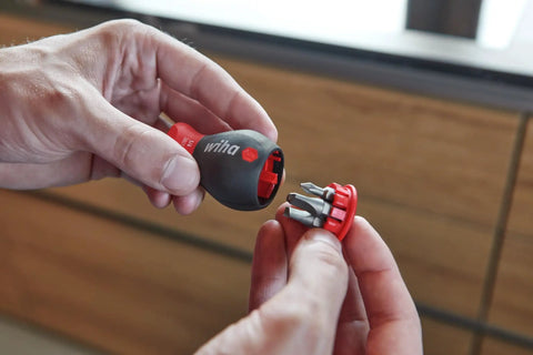 Hands holding a Compact Stubby Screwdriver With Six In One Torx Bits T8 T10 T15 T20 T25 T30 Soft Finish Cushion Grip