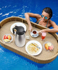 Double Walled Stainless Steel Thermal Coffee Carafe 68-Ounce Two-Liter Capacity Dispenser on floating tray in pool
