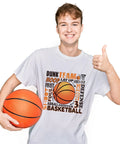 Teen wearing white t-shirt with Basketball Iron On Transfer Patches Set Four Designs For Kids Teens Shirts and holding basketball.