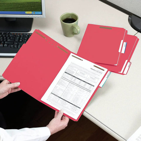 Letter Size Red Fastener Folders With Heavy Duty Embedded Straps And Assorted One Third Cut Tabs For Hustle Free Filing And Crisp Office Archiving Pack Of Fifty on desk with paperwork.