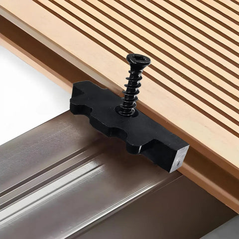 500 Pack Rock Solid Hidden Deck Fasteners For Composite Board With Stainless Steel Screws And Universal Nylon Hideaway Clips close-up view of black nylon clip with screw on composite decking.