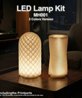 Two lit Three Color LED Lamp Kit 3Pcs for 3D Printers on a table, emitting warm light, with textured designs, in a cozy room setting.