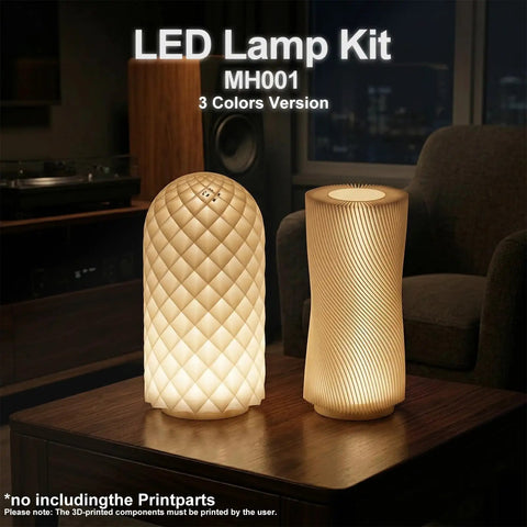Two lit Three Color LED Lamp Kit 3Pcs for 3D Printers on a table, emitting warm light, with textured designs, in a cozy room setting.