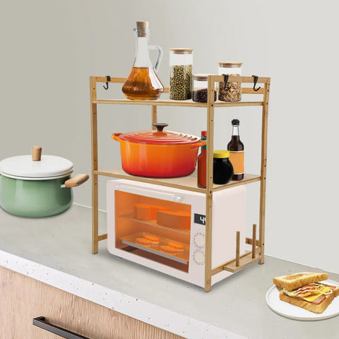 Top Shelf Heavy Duty Double Tier Microwave Stand With Cutting Board Holder And Four Utensil Hooks For Countertop Storage Kitchen Organization No Sweat Setup with cookware and spices.