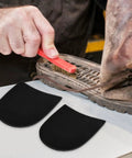 Close-up of No Slip Heel Patches for Boots and Sneakers Rubber Heel Pad Repair Patches with shoe sole being cleaned.