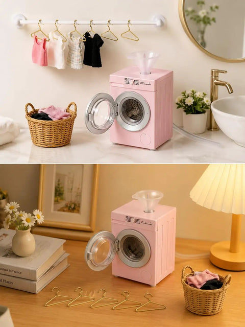 Insanely Detailed One To Twelve Scale Miniature Washing Machine With Five Metal Hangers And Rotating Drum Front Load Washer Replica displayed with clothes.