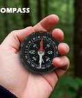 Hand holding Water Resistant Hiking Compass With Lensatic Bearing Guide in forest for navigation