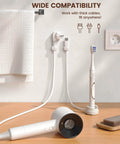 Six Pack 360 Degree Rotatable Cord Organizer Clips With One Second Lock Spring Cord Holder on bathroom wall holding cables.