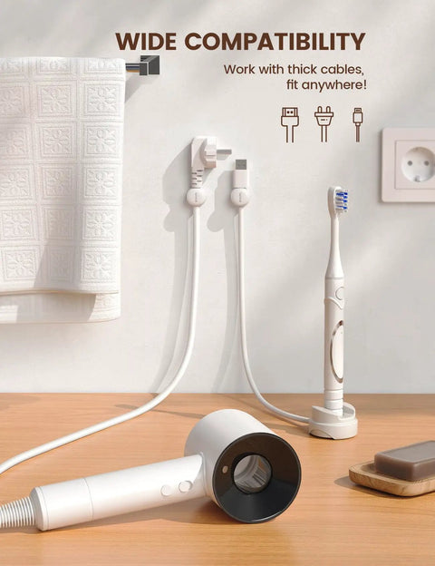Six Pack 360 Degree Rotatable Cord Organizer Clips With One Second Lock Spring Cord Holder on bathroom wall holding cables.