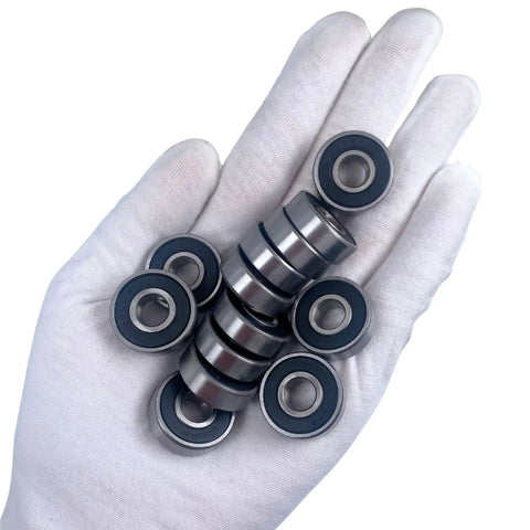 608 2RS Ball Bearings Set 100 Pack 8x22x7mm Sealed Chrome Steel, held in a hand, for skateboards, inline skates, and 3D printers.