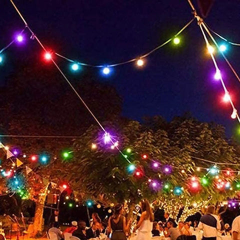 Outdoor party with colored lights using Purple Shatterproof 1W LED G40 Globe Bulbs For Indoor Outdoor Patio String Lights With E12 C7 Candelabra Base Durable Plastic Build 15 Pack Perfect For Patio Decor And Parties hanging overhead.