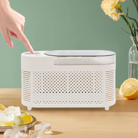 Quick Chill Portable Ice Cube Maker For Home Or Car, slick white compact build with touch button for easy operation.